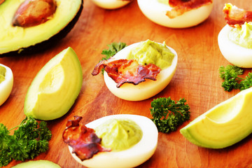 deviled eggs  with avocado and bacon