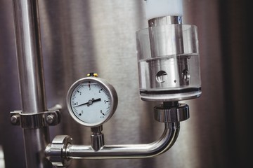 Pressure gauge on storage tank in brewery