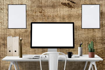 Moderne Arbeitsplatz - Schreibtisch mit großem PC-Bildschirm und Dekoration -  leere Bilderrahmen - Textfreiraum