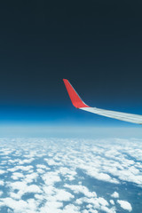 Fototapeta na wymiar high above the sky - travel by airplane