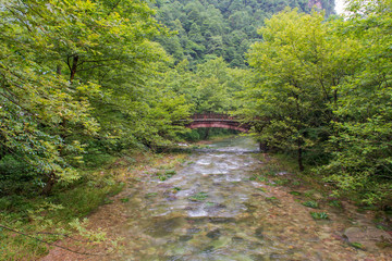 Waterfall and bridge in Golden whip stream at Zhangjiajie Nation