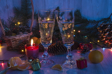 Christmas holidays with two glass of champagne and burning candl