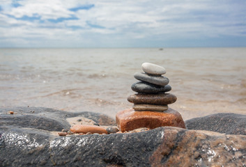 Stack of stones on the seaside in summer