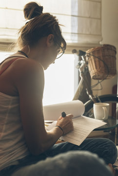 Woman at home working on script