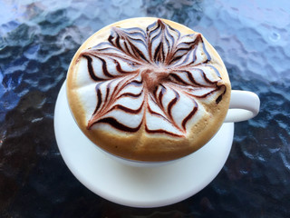 Coffee art in white cup