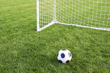 Classical football on the soocer field - playground