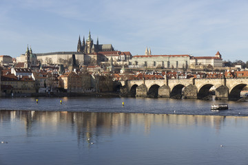 Fototapeta premium Autumn Lesser Town of Prague with gothic Castle and Charles Bridge, Czech Republic