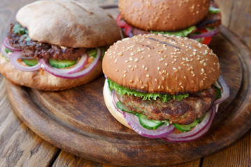 Classic american burgers, fast food on wood background