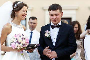 beautiful and young couple  receiving congratulations and gifts