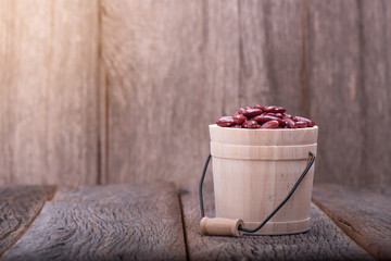 Beans on wood background.