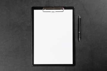 Black clipboard on a table