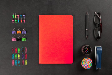 Office supplies on a black table