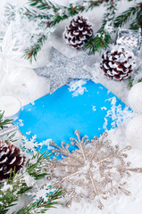Christmas card with decorated fir tree on snow.