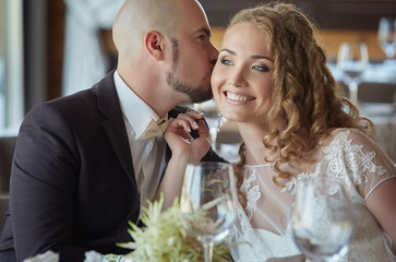 The groom and the bride in a restaurant.