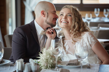 The groom and the bride in a restaurant.