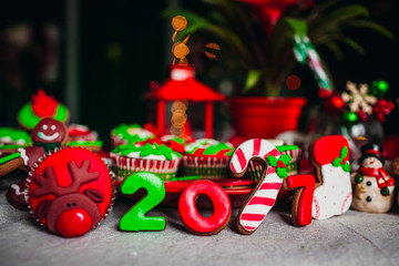 The Christmas cakes and figures  stand on the table