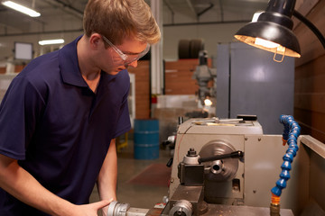 Male Engineer In Factory Using Milling Machine
