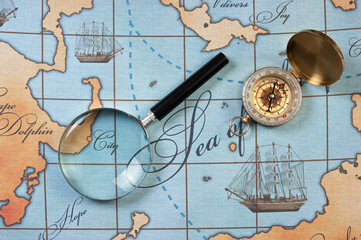 magnifier and compass on  map