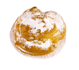 Profiterole with powdered sugar isolated on a white background