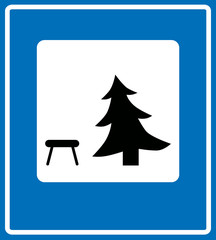 Vector icon illustration showing a picnic table and a pine tree, picnic area
