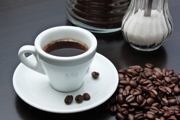 pile of coffee beans and a cup