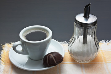cup of coffee and chocolate candy