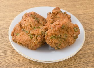 Thai Fish Cakes Served on A White Dish