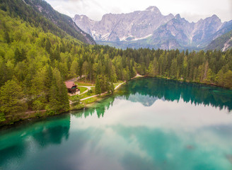 Aerial: Beautiful Mountain Lake Landscape With Panoramic View Of Mountain Alps On Background
