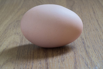 Egg on wood background