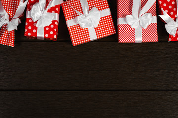 Fototapeta premium Holiday red christmas gift box background, Top view celebrate