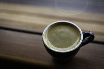 americano coffee or espresso coffee on a side of the window in t