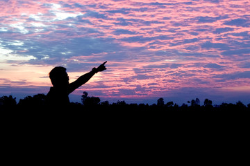 silhouette sky man pointing at the sky,future goal vision concept