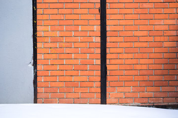 Brick wall, snow.