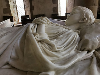 BAKEWELL, ENGLAND - DECEMBER 4: Interior of chapel at Haddon Hall. Tomb of young Lord Haddon in marble. In Bakewell, Derbyshire, England. On 4th December 2016.