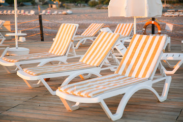 Beach beds at wooden pier
