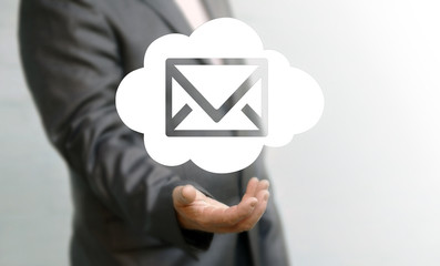 Business email marketing communication concept. Businessman offers cloud mail envelope icon. 