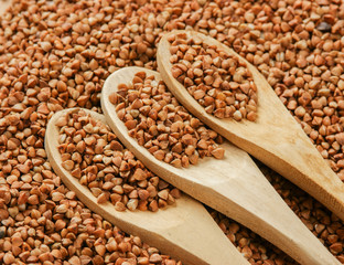 buckwheat groats and wooden spoon