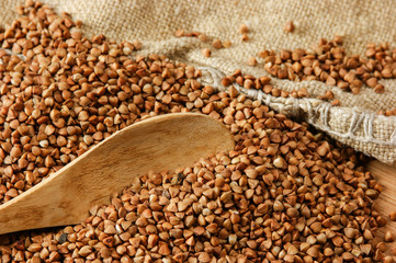 buckwheat groats and wooden spoon