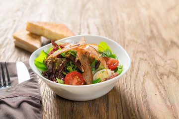 Fresh breakfast Omelette Salad with Parma Ham, feta cheese and vegetables.