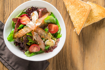 Fresh breakfast Omelette Salad with Parma Ham, feta cheese and vegetables.