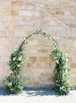 Floral arch against wall