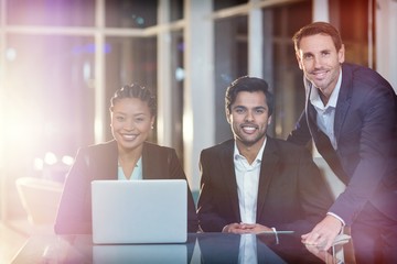 Portrait of business people sitting in meeting