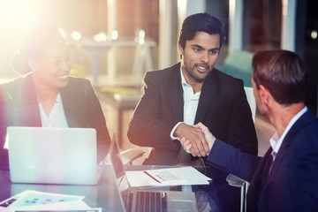 Businessman shaking hands with colleague