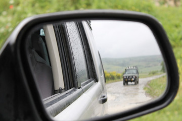 car image reflected in the mirror