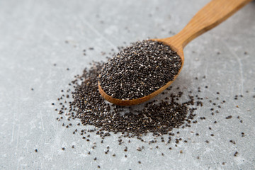 Chia seeds in a wooden spoon. Superfood, healthy concept