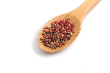 Brazilian Pink Pepper into a spoon