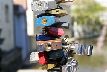 Love locks hang from a bridge in Prague representing secure friendship and romance
