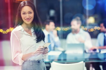Businesswoman holding mobile phone