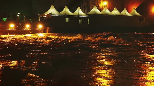 flood of the river during the night in Rome: tevere, tiber, slow motion