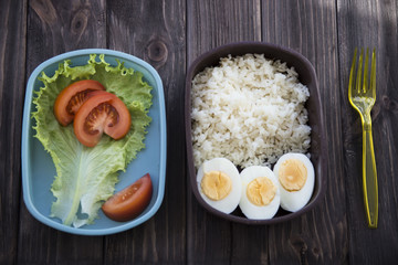 
healthy food in the container - rice, eggs, vegetables